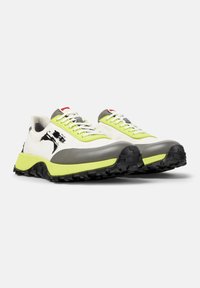 Lightweight running shoes with a white mesh upper, yellow accents, gray rubber toe, and textured black sole for traction. Features a graphic design.