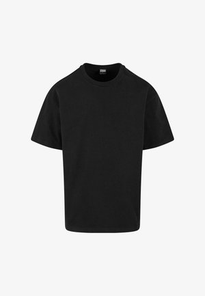Melna kokvilnas T-krekls ar klasisku apaļu kakla izgriezumu, īsām piedurknēm un brīvu piegriezumu. Gluda tekstūra, vienkāršs dizains, bez rakstiem vai akcentiem.
