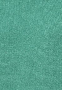 Tessuto lavorato a maglia verde mare con un motivo a punto fine e uniforme.