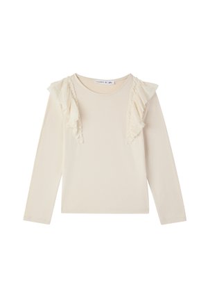 Maglia a maniche lunghe color beige chiaro con dettagli arricciati lungo le spalle, realizzata in un tessuto morbido con una texture liscia.