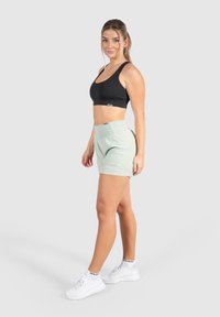Smilodox ADVANCE PRO 2IN1 - Urheilushortsit - grün