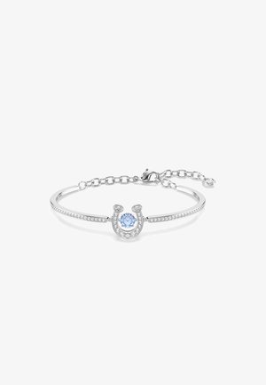 Silver bracelet with a horseshoe design, featuring a central blue stone and surrounded by clear stones along the band and chain.