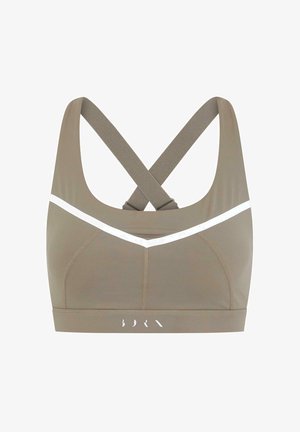 Soutien-gorge de sport dans une teinte brun discret avec un accent en chevron blanc. Dispose de bretelles croisées et d'un tissu lisse pour le confort et le soutien.