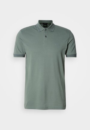 Short-sleeve polo shirt in muted green cotton with a three-button placket, tonal logo, and contrasting gray accents on collar and cuffs.