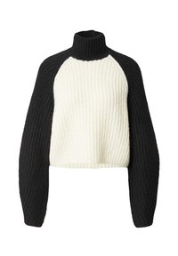 Chunky gebreide coltrui met een witte body en zwarte, geribbelde mouwen. Verkorte ontwerp met gestructureerde stof en brede mouwen.