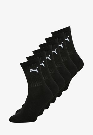 Schwarze Knöchelsocken im 5er-Pack. Hergestellt aus gestricktem Material mit gerippten Bündchen und einem weißen Puma-Logo auf jeder Socke.