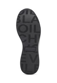 Sole di scarpa nera in gomma con scanalature testurizzate e nome del marchio impresso "VOILE BLANCHE." Presenta vari pattern e design su tutta la superficie.