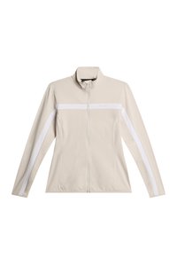 Giacca beige con zip e colletto alto, caratterizzata da strisce diagonali bianche sulle maniche, texture liscia e logo discreto sul petto.