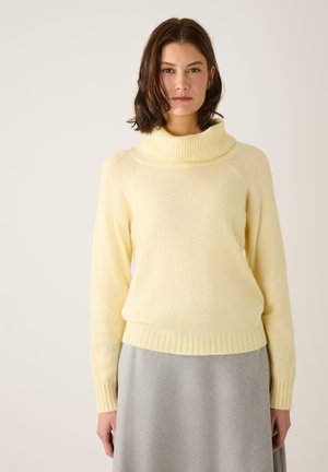 Hellgelbes Sweatshirt mit Schalkragen, langen Ärmeln und gerippten Bündchen. Hergestellt aus weichem Stoff, hat es eine lässige Passform und eine glatte Textur.