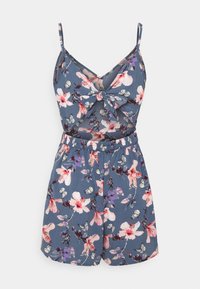 Combinaison à imprimé floral bleu foncé, avec un décolleté en V, un nœud sur le devant, des bretelles spaghetti ajustables et une taille élastique.
