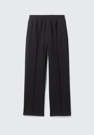 Black wide-leg trousers made of a smooth fabric. Features an elastic waistband and two side pockets. Tailored design with front pleats.