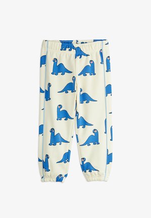 Children’s cream pants with elastic waist and ankles, decorated with repeating blue cartoon dinosaur pattern.