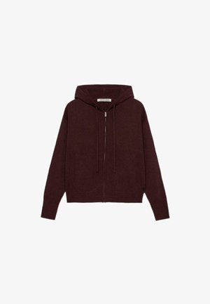 Burgunderfarbene Zip-Hoodie aus einem weichen Strickmaterial mit Kapuze mit Zugband, gerippten Bündchen und vorderen Taschen. Strukturierte Stoffdetails.
