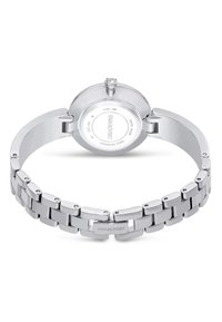 Zegarek ze stali nierdzewnej z srebrną bransoletą i tyłem. Posiada okrągłą kopertę, przezroczysty akcent w postaci kryształu oraz zapięcie z logo na środku.