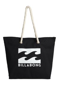 Black canvas tote bag with white wave logo and "BILLABONG" text. Features thick, twisted cream-colored rope handles and metallic eyelets.