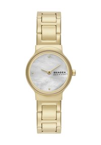 Gold metal link bracelet watch with small round white mother-of-pearl dial, minimalist gold markers, and Skagen Denmark logo.