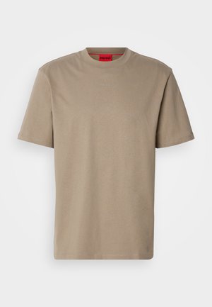 Beige cotton t-shirt with a crew neckline, short sleeves, and a subtle embossed logo in the center. Features a red inner tag.