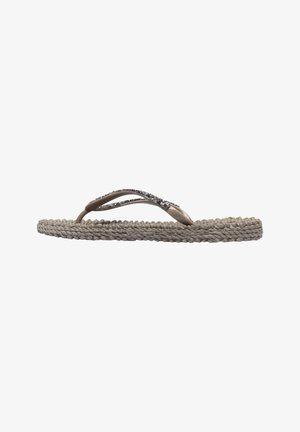 Tan flip-flop with braided jute sole, two-tone straps with an accent of clear rhinestones, flat and minimalist design.