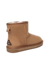 Brown suede ankle boot with soft interior lining, rounded toe, and a rubber sole. Features a small rear pull tab and logo accent.