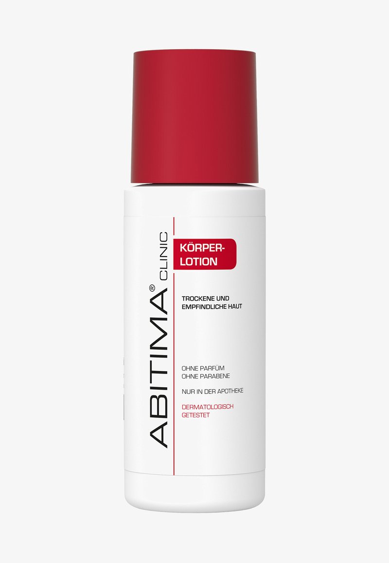 Weiße zylindrische Flasche mit rotem Deckel. Der Text auf der Vorderseite gibt an "Körper-Lotion" für trockene, empfindliche Haut; gekennzeichnet als dermatologisch getestet.
