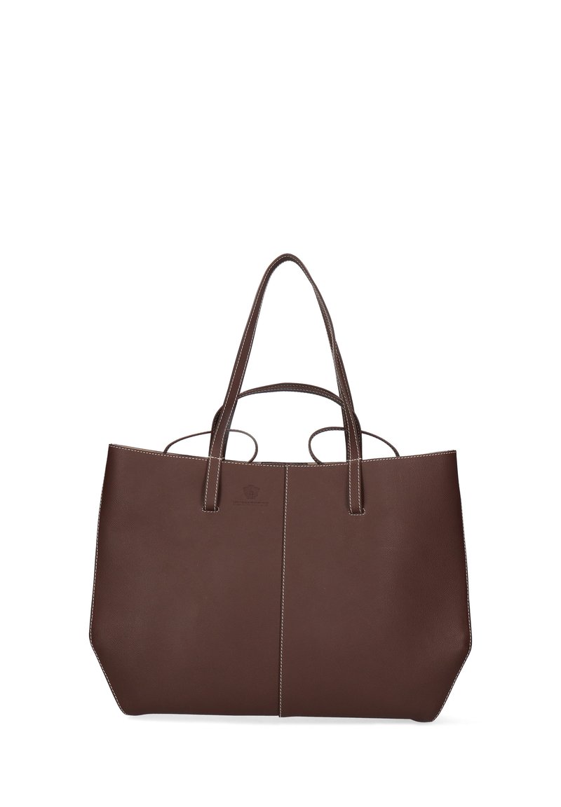 Borsa tote in pelle marrone scuro con doppio manico, cuciture bianche e una forma leggermente trapezoidale su uno sfondo bianco.