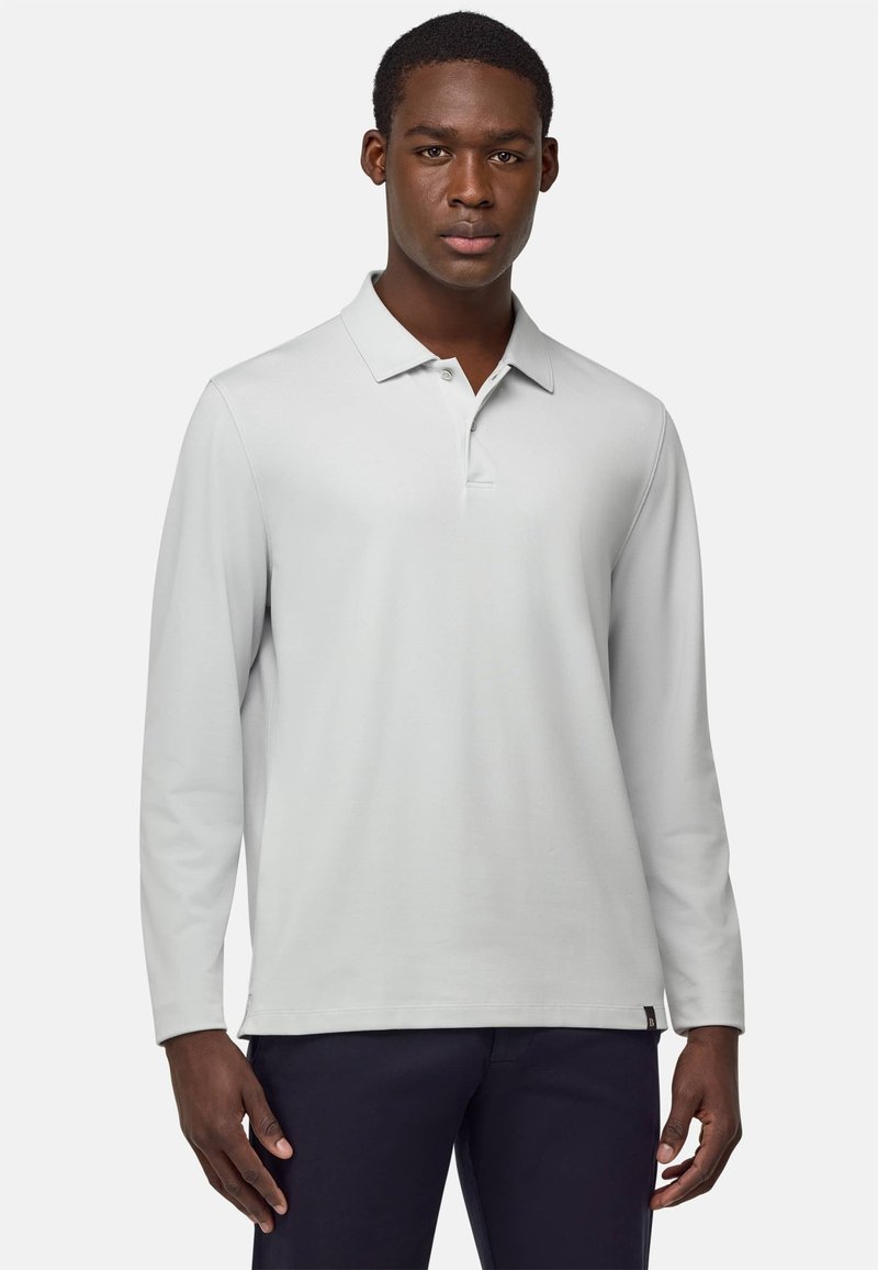 Lange mouwen polo shirt in lichtgrijze stof, met een klassieke kraag, een drieknoopsluiting en een klein logotag aan de zoom.