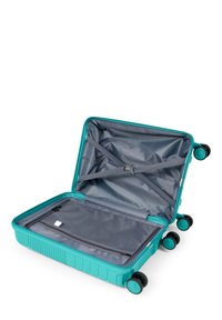Valigia rigida color turchese con interno grigio, quattro ruote, cinghie interne e un compartimento con zip per uno stoccaggio organizzato.