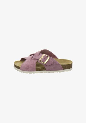 Pink suede slide sandal with crisscross straps, gold buckle, cork footbed, and white ridged sole.