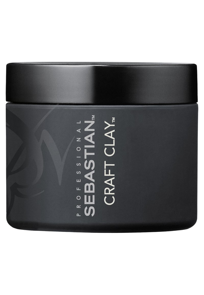 Zwarte ronde container van Sebastian Craft Clay, met een gladde matte afwerking, zilveren tekst en een zwart deksel met een minimalistisch merkontwerp.