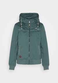 Teal windbreaker jacket with a hood, featuring zip closure, two side pockets, and ribbed cuffs. Embellished with decorative stitching.