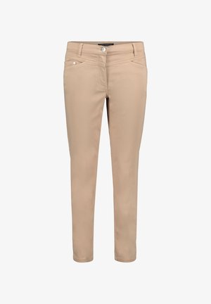 Beige slim-fit pants made of a smooth, stretchy material. Features front pockets, a button closure, and decorative stitching on the front.