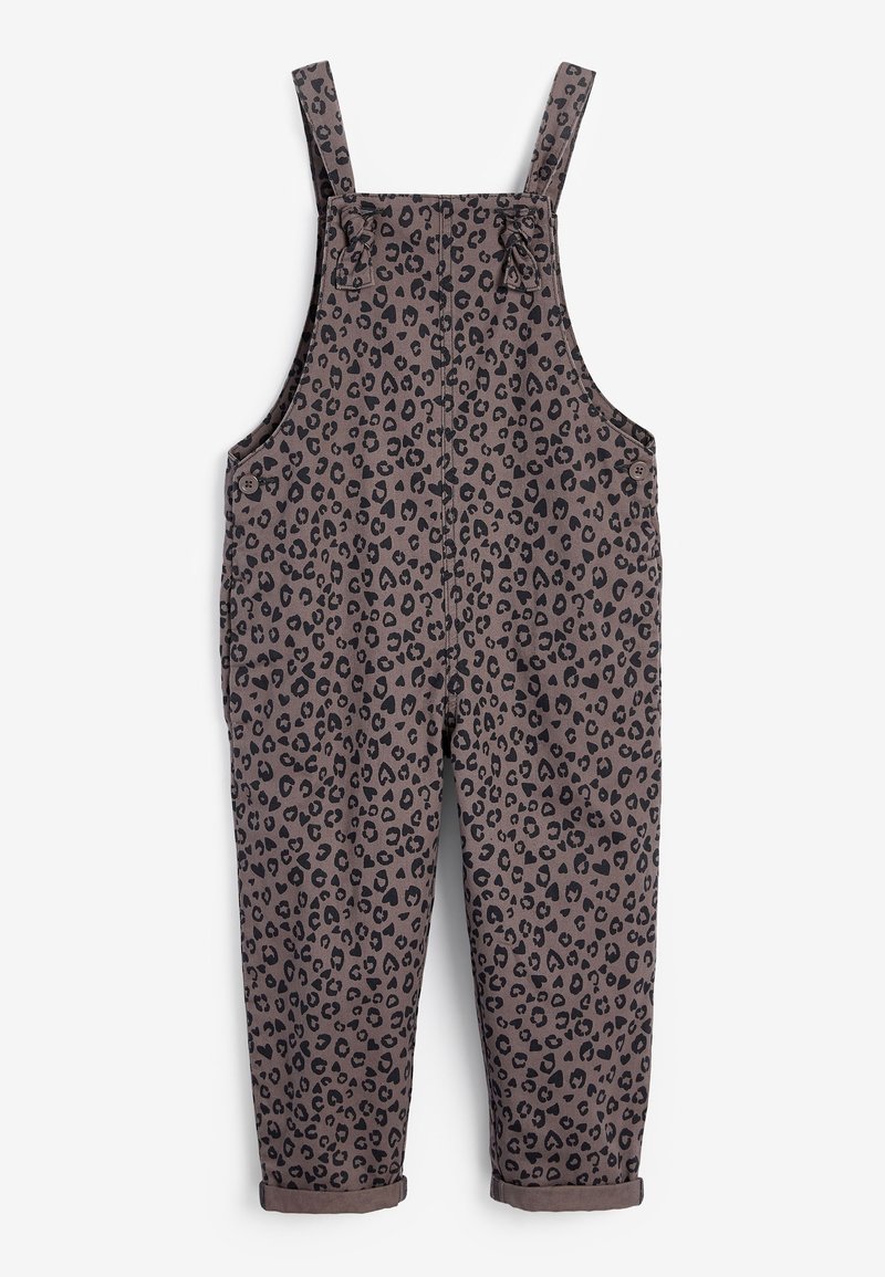 Salopette brune avec un motif léopard noir, bretelles ajustables, boutons sur les côtés et ourlets retroussés aux chevilles. En matière de coton.