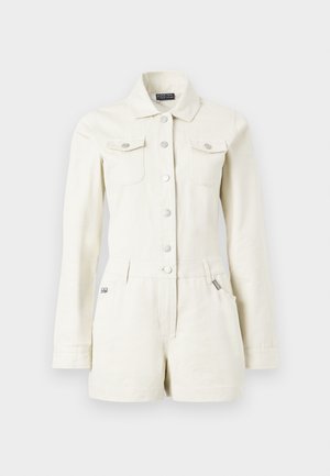 Elevandiluunivärvi pikkvillane pikkade varrukatega lühike teksakombinesoon, millel on nööpidega esikülg, krae, kaks rinnaääre taskut, vööaasad ja küljetaskutega lühikesed püksid.