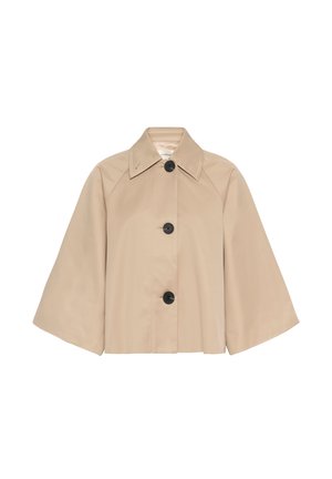 Beige cropped jack met brede mouwen, grote zwarte knopen en een puntige kraag, afgebeeld op een witte achtergrond.