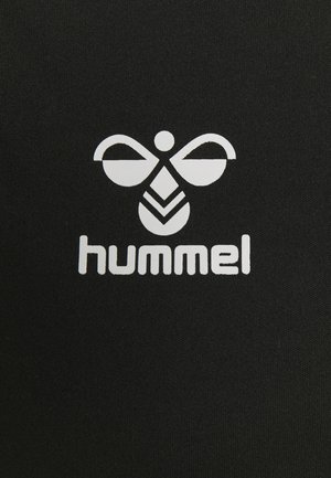 Black fabric features a white logo with abstract bee design above the text "hummel," emphasizing bold contrast and minimalistic styling.