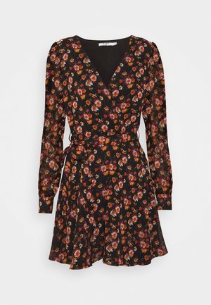 Black floral wrap dress with long sleeves, featuring a deep V-neck, cinched waist, and a flared skirt with multicolored flower patterns.