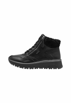 Bottines en cuir noir avec zips sur le côté, doublure en fausse fourrure, semelles en caoutchouc texturé et cols rembourrés pour le confort et la chaleur.