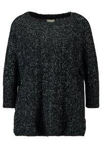 Maglione lavorato a maglia in bianco e nero con una vestibilità ampia, scollatura rotonda e maniche a tre quarti. Il motivo testurizzato su tutta la superficie conferisce uno stile accogliente.