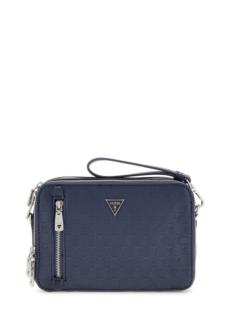 Geantă crossbody de culoare albastru marin, confecționată dintr-un material sintetic texturat, având închidere cu fermoar, curea de umăr și un plăcuță cu logo pe față.