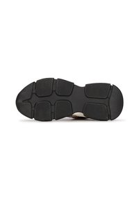 Suola di scarpa in gomma con un motivo nero texturizzato, caratterizzata da scanalature di trazione distinte e un design della punta arrotondata per aderenza e stabilità.