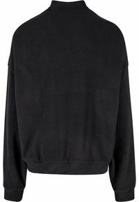 Svart långärmad sweatshirt med hög krage, avslappnad passform samt ribbade ärmslut och nederkant, sedd bakifrån.