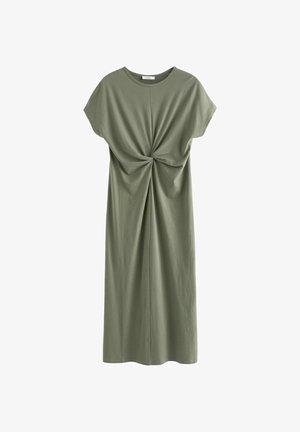 Žalia alyvuogių spalvos suknelė, pagaminta iš medvilnės, pasižyminti laisvu kirpimu, trumpomis rankovėmis ir priekyje esantį mazgo detalę su surinkta medžiaga, suteikiančia tekstūrą.