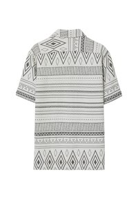 Camicia a maniche corte bianca con motivi geometrici neri, dotata di colletto e orlo dritto. Tessuto testurizzato.