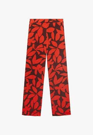 Red and black pants featuring a floral pattern with large leaves. The design is bold with a smooth texture, straight cut, and no visible hardware.