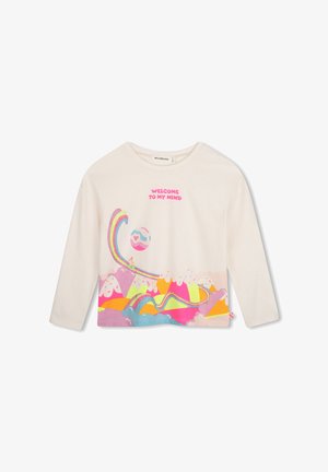 T-shirt crème à manches longues avec un motif coloré d'arc-en-ciel, de nuages et de montagnes, et texte rose "WELCOME TO MY MIND" sur la poitrine.