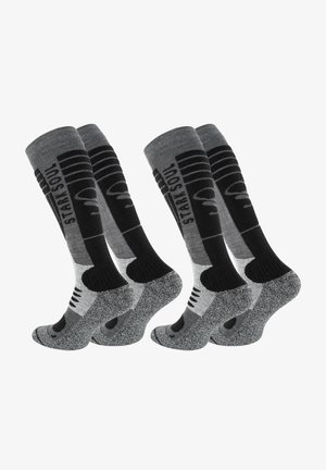 Kniestrümpfe in Grau und Schwarz, mit schlichtem Design und kontrastierenden Mustern, gepolsterten Sohlen sowie verstärkten Fersen- und Zehenbereichen.