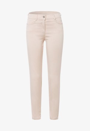Beige slim-fit jeans made of stretch cotton, featuring five pockets, a zip fly with a button closure, and subtle stitching details.