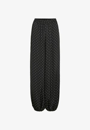 Pantalon noir à jambes larges avec des pois blancs, taille élastique et poignets élastiques froncés aux chevilles.