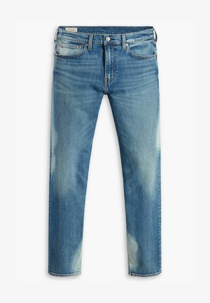 Blauwe vervaagde slim-fit jeans met vijf zakken en knoopsluiting, met subtiele slijtage en beschadigingen op de bovenbenen en knieën.