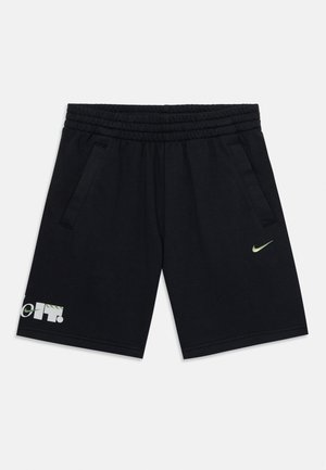 Shorts de sport noirs avec taille élastique, poches latérales, petit logo Nike vert sur la jambe droite et texte "Just Do It" sur l'ourlet de la jambe gauche.